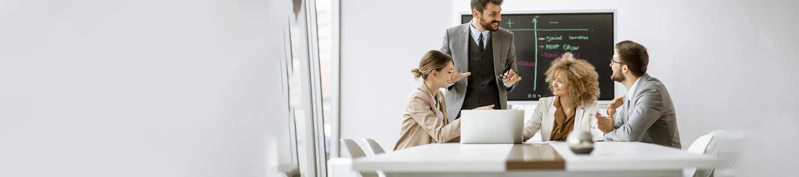 An Insurance Advisor holding a tablet in front of the office cabin