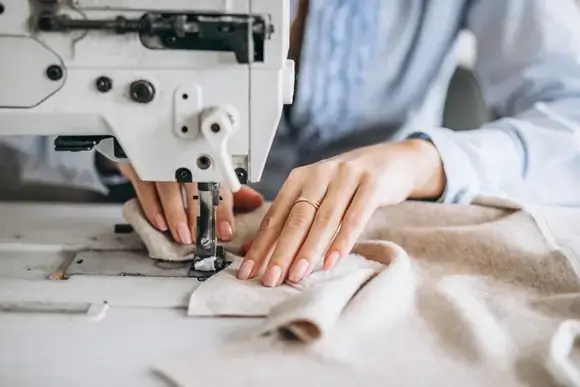 woman  working with sewing machine