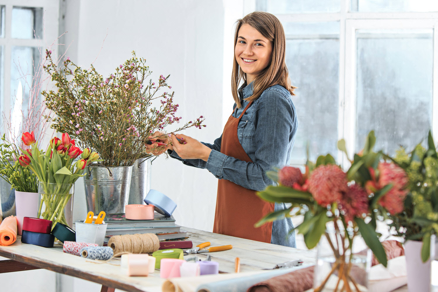 young florist business owner smiling