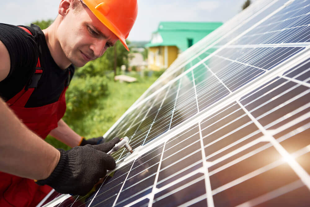 Technician inspecting solar