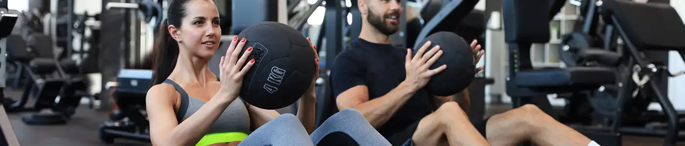 Exercise with medicine ball in gym