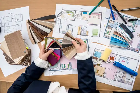 Woman working with color palette with house plan