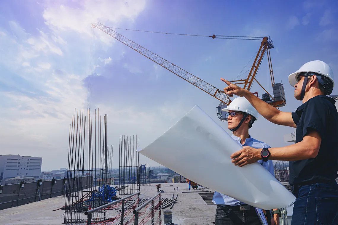 Contractor and female worker discussing on project