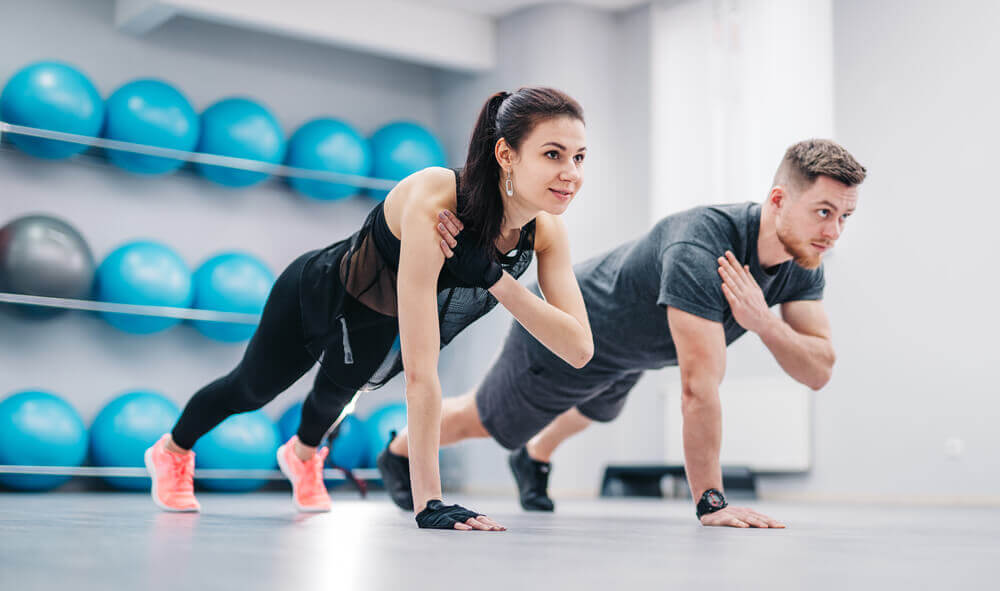 Young Couple Doing Yoga