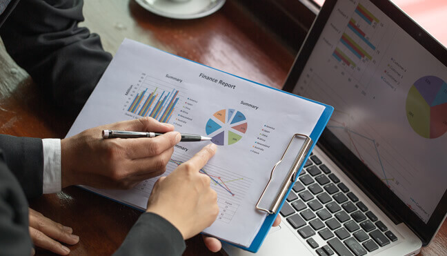 two people going over a Finance Report Chart